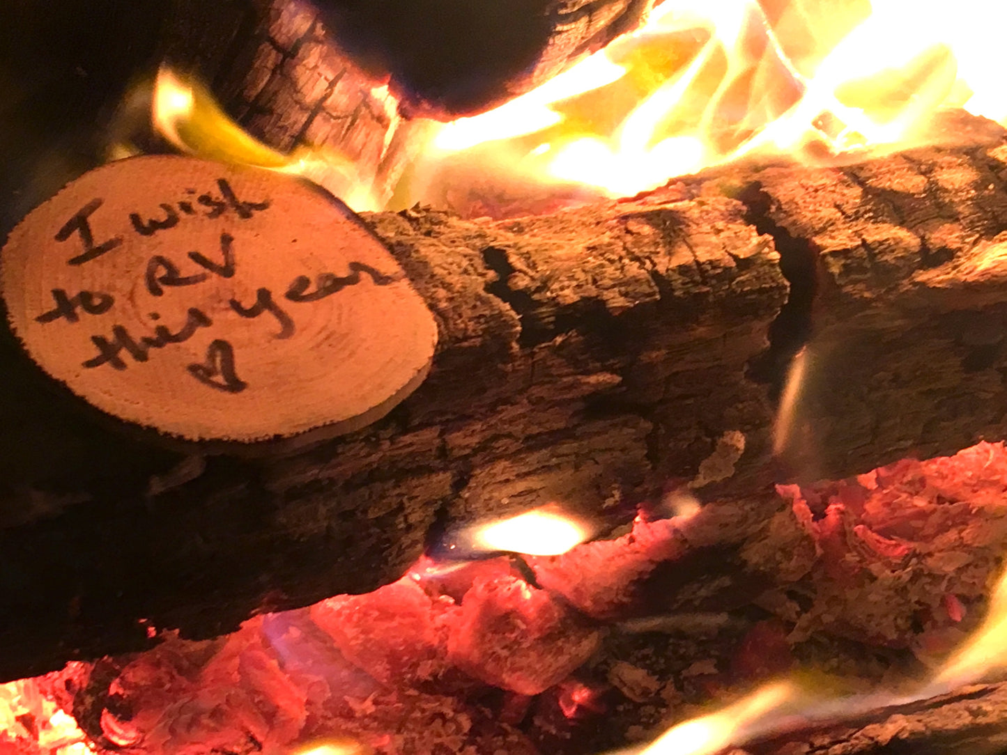 <img src="fire-outside-nature-wishes-experience_jpg”  alt="enjoying nature outside around a campfire making wishes - wish wood - for making memories and experiences"/>