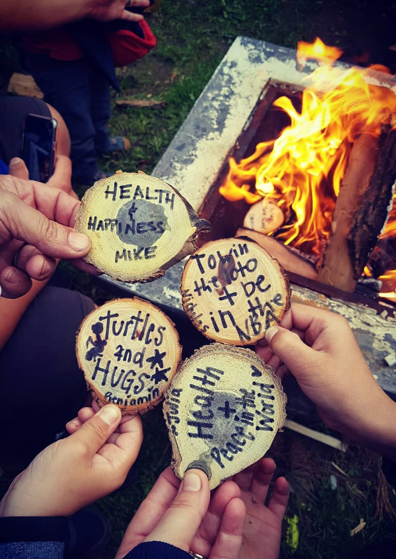 <img src="family-and-friends-showing-wishes-made-at-campfire_jpg”  alt="family and friends showing the wishes they made at a campfire - wish wood - for making memories and experiences"/>